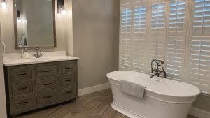 Beautiful bathroom with the bathtub and shutter installed on it